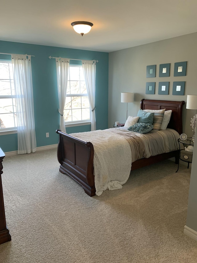 bedroom featuring carpet floors and baseboards