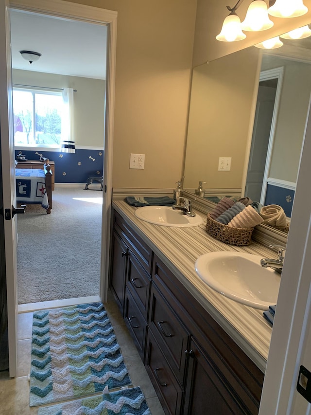 full bathroom featuring double vanity and a sink