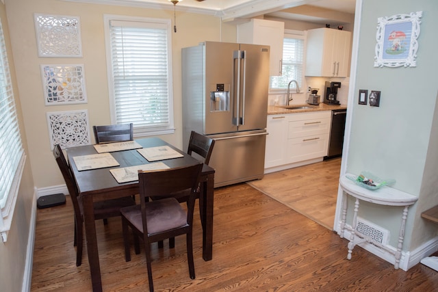 dining space with light wood-type flooring