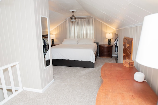 carpeted bedroom with lofted ceiling and a ceiling fan