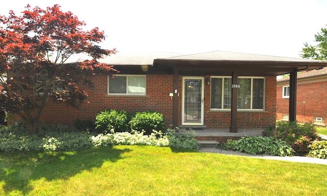 1506 E Windemere Ave, Royal Oak, MI 48073 - view of front of home featuring covered porch, brick siding, and a front yard