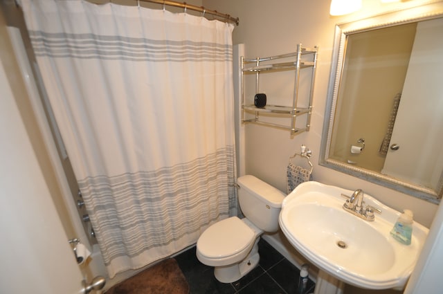 1506 E Windemere Ave, Royal Oak, MI 48073 - bathroom with a sink, shower / bathtub combination with curtain, tile patterned floors, and toilet