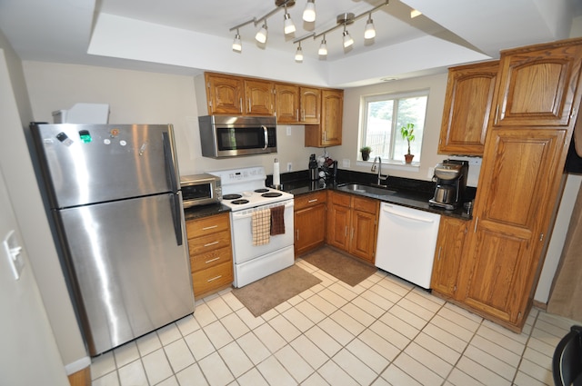 1506 E Windemere Ave, Royal Oak, MI 48073 - kitchen featuring a sink, appliances with stainless steel finishes, brown cabinets, and dark countertops