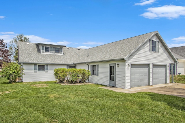 view of front of home with concrete driveway, a shingled roof, a front yard, and a garage