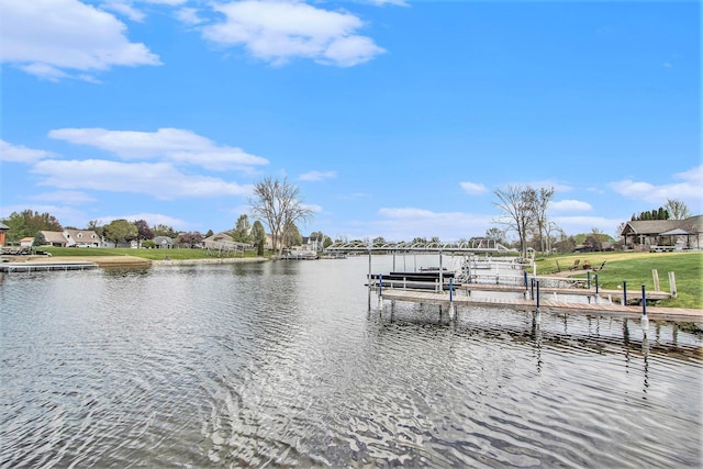 dock area with boat lift and a water view