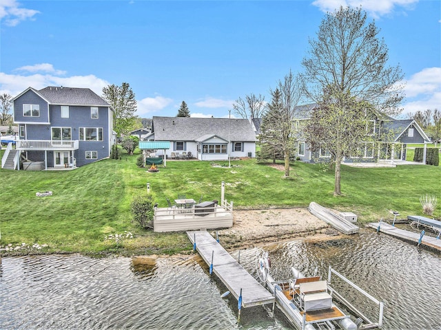 view of dock with a yard and a deck with water view