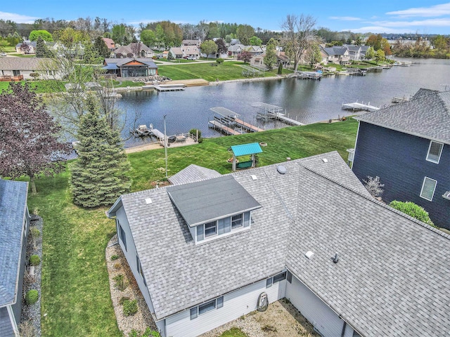 birds eye view of property featuring a water view and a residential view
