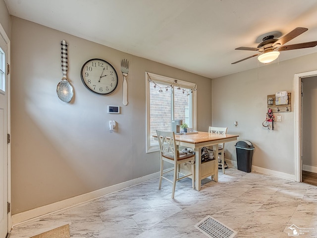 dining space with baseboards, ceiling fan, marble finish floor, and visible vents