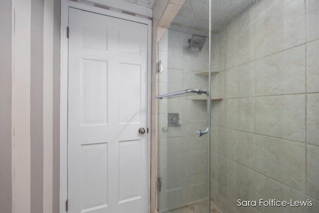 bathroom featuring a shower stall