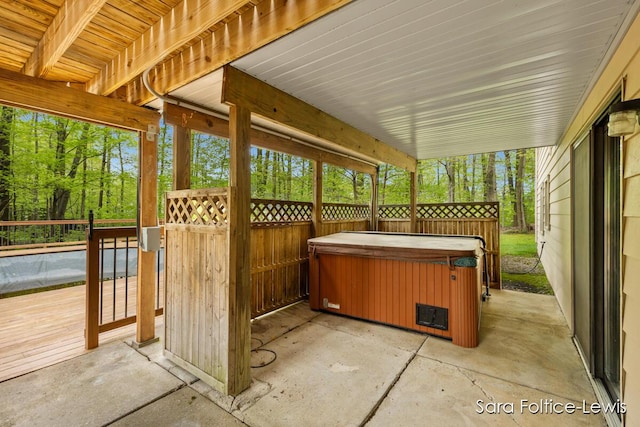view of patio / terrace with a hot tub