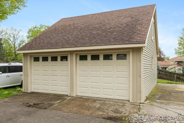 detached garage with fence