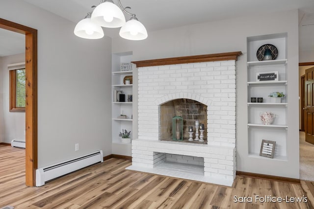 unfurnished living room featuring baseboards, wood finished floors, and a baseboard radiator