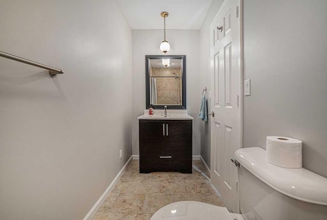 410 Orchard Ct, Saint Louis, MI 48880 - bathroom with vanity, toilet, and baseboards