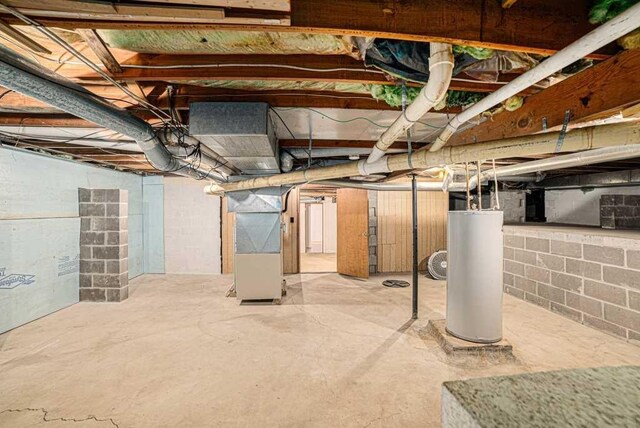 410 Orchard Ct, Saint Louis, MI 48880 - unfinished basement with heating unit and gas water heater