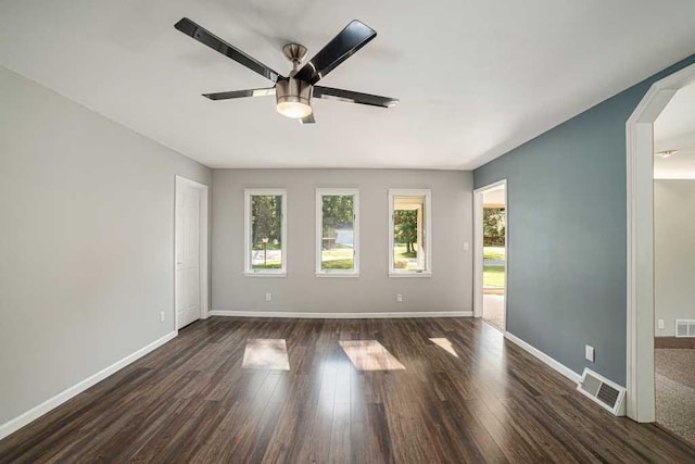 410 Orchard Ct, Saint Louis, MI 48880 - spare room featuring baseboards, a ceiling fan, visible vents, and dark wood-type flooring