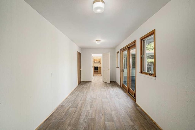 410 Orchard Ct, Saint Louis, MI 48880 - hall featuring wood finished floors and baseboards