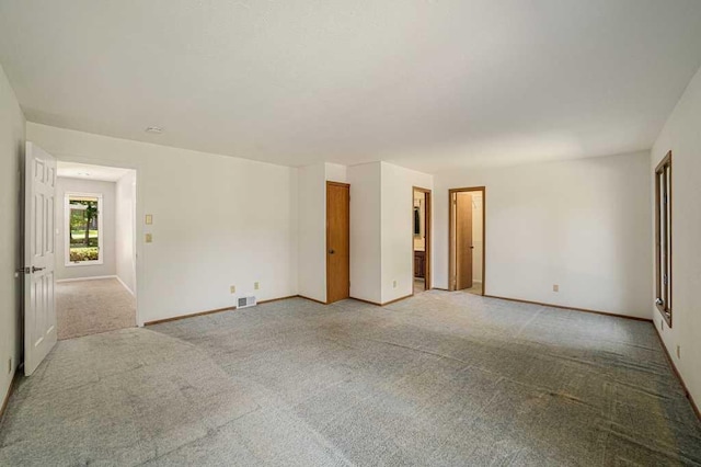 410 Orchard Ct, Saint Louis, MI 48880 - empty room with light colored carpet, visible vents, and baseboards