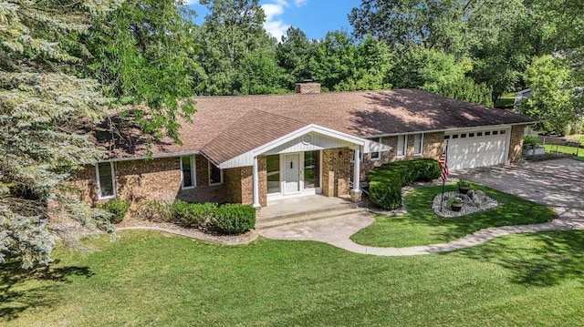 410 Orchard Ct, Saint Louis, MI 48880 - ranch-style house featuring a garage, a chimney, aphalt driveway, a front lawn, and brick siding