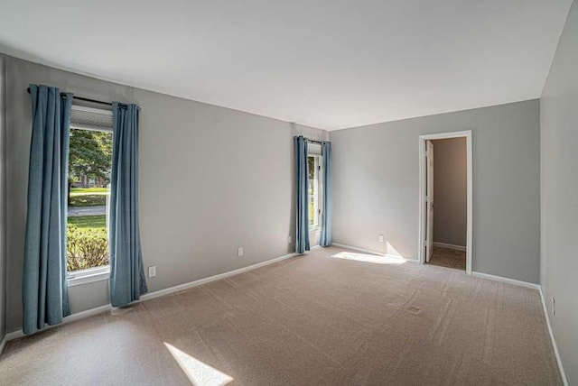 410 Orchard Ct, Saint Louis, MI 48880 - carpeted spare room featuring baseboards and a healthy amount of sunlight