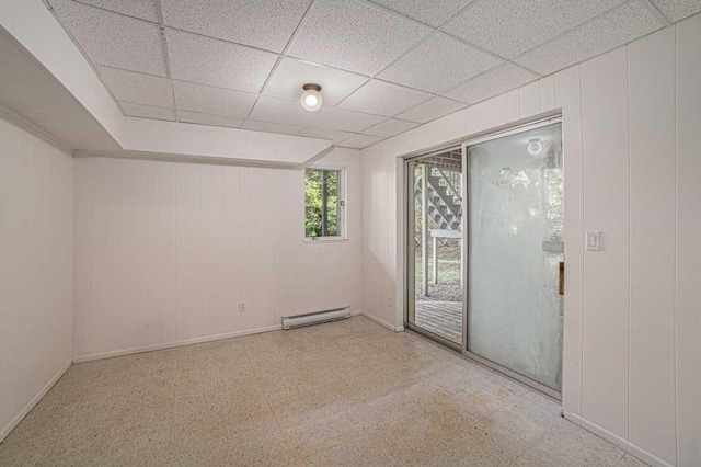 410 Orchard Ct, Saint Louis, MI 48880 - spare room featuring a drop ceiling, baseboards, and baseboard heating