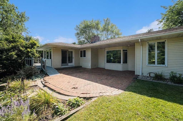 410 Orchard Ct, Saint Louis, MI 48880 - back of property featuring a chimney and a lawn