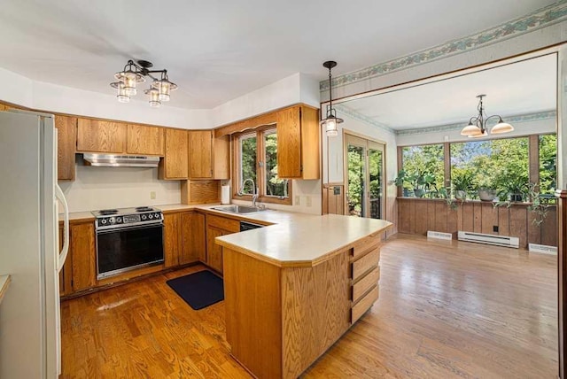 410 Orchard Ct, Saint Louis, MI 48880 - kitchen with freestanding refrigerator, an inviting chandelier, baseboard heating, and electric stove