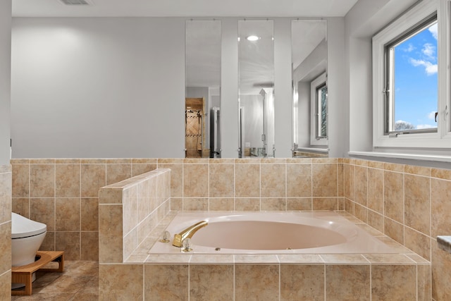 5615 Woodmire Dr, Macomb, MI 48316 - full bathroom featuring toilet, visible vents, and a bath