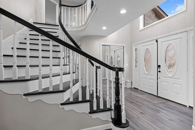 5615 Woodmire Dr, Macomb, MI 48316 - entryway with recessed lighting, stairs, a towering ceiling, and wood finished floors