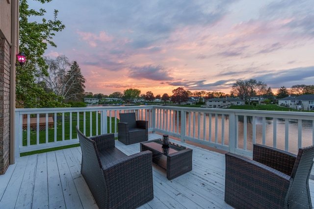 5615 Woodmire Dr, Macomb, MI 48316 - deck at dusk with a water view