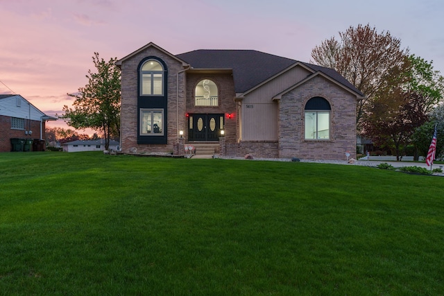 5615 Woodmire Dr, Macomb, MI 48316 - traditional home featuring brick siding and a front yard