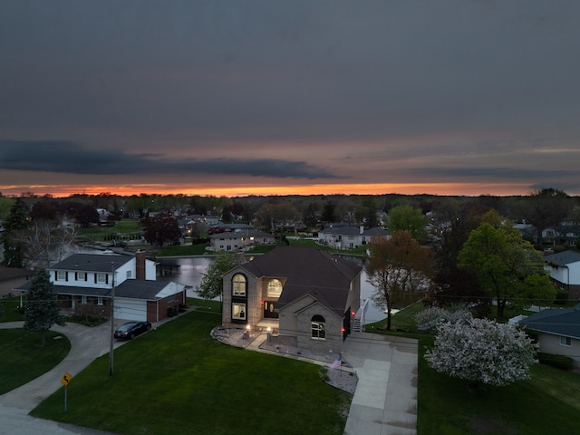 5615 Woodmire Dr, Macomb, MI 48316 - aerial view at dusk with a residential view and a water view