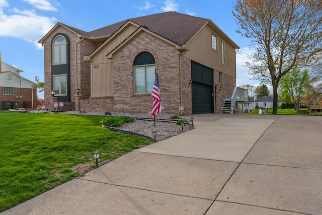5615 Woodmire Dr, Macomb, MI 48316 - traditional-style home featuring a shingled roof, an attached garage, brick siding, a front yard, and concrete driveway