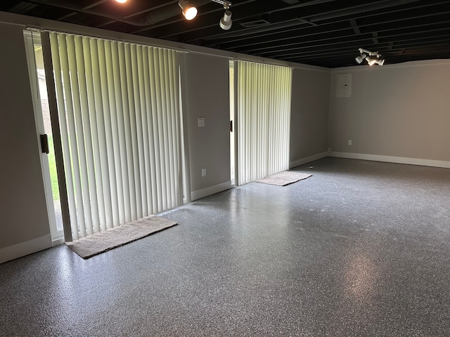 spare room featuring baseboards