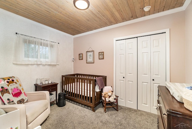 1349 Mckimmy Rd, Beaverton, MI 48612 - carpeted bedroom with crown molding, a nursery area, wood ceiling, and a closet