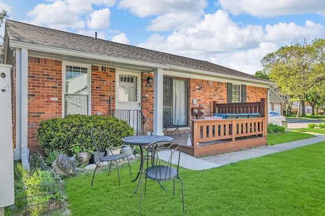 2917 Whittier Ct, Ann Arbor, MI 48104 - rear view of property featuring brick siding, a lawn, and a porch