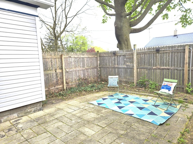 view of patio / terrace featuring fence