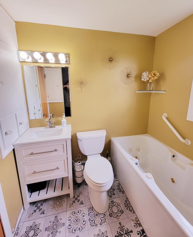 full bathroom with tile patterned floors, a whirlpool tub, vanity, and toilet