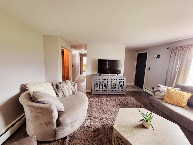 living room featuring baseboards, a baseboard radiator, wood finished floors, and baseboard heating