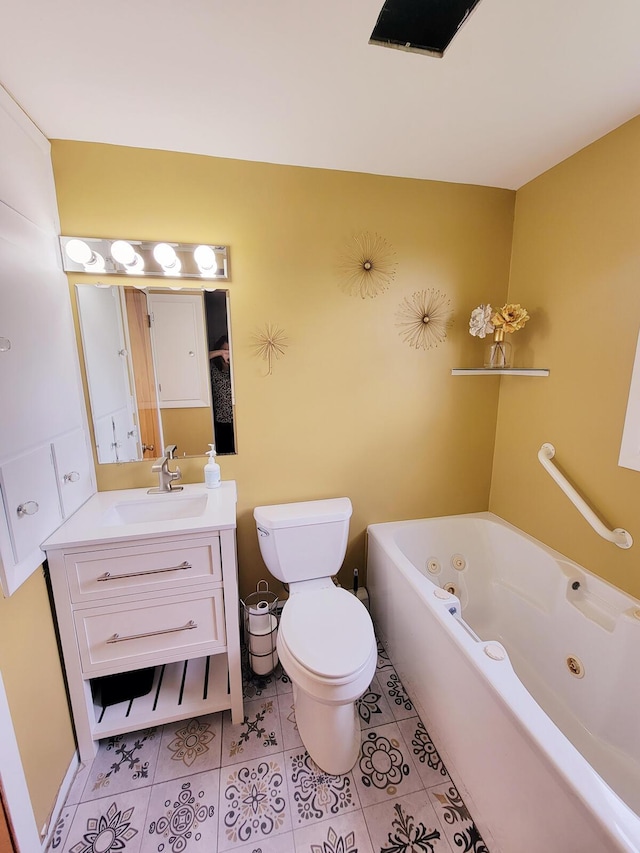 bathroom with vanity, a whirlpool tub, toilet, and tile patterned floors