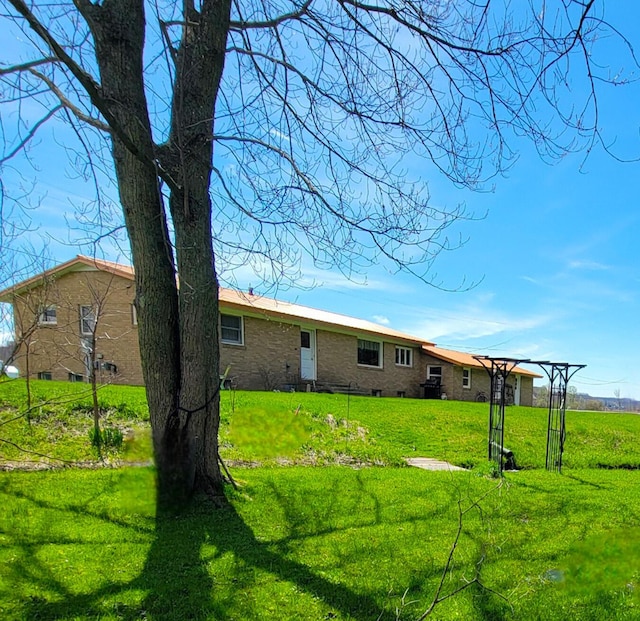 back of house with a yard