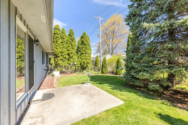 view of yard featuring a patio and a fenced backyard