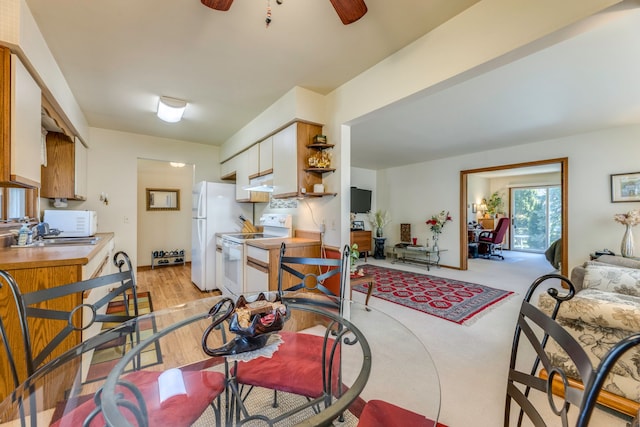 kitchen featuring a ceiling fan, open shelves, under cabinet range hood, white appliances, and white cabinetry