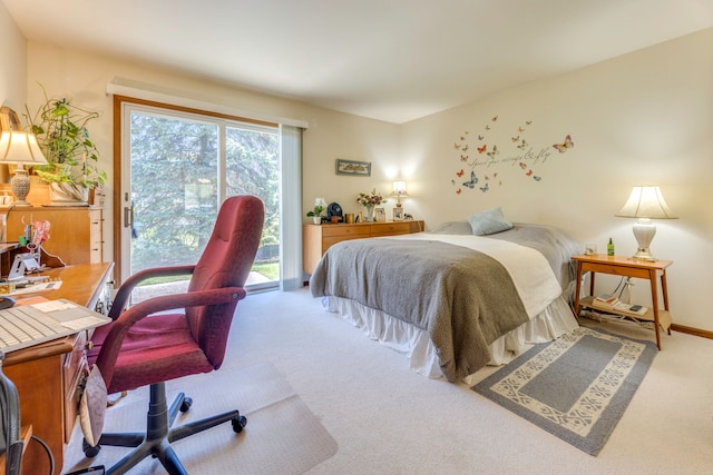 bedroom featuring access to exterior and carpet