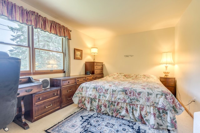 bedroom with light colored carpet