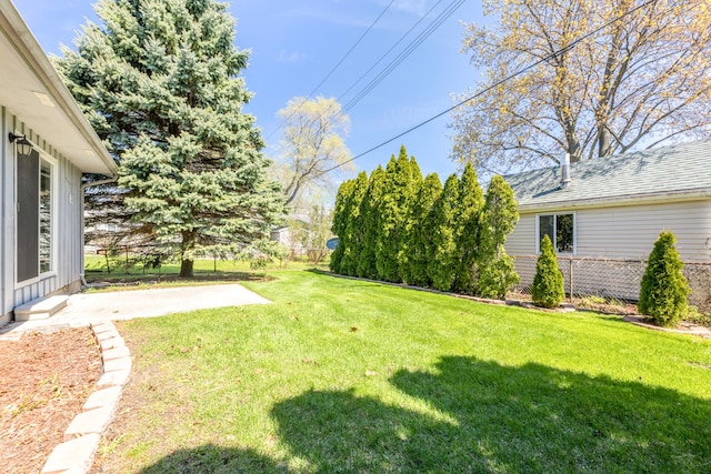 view of yard featuring fence