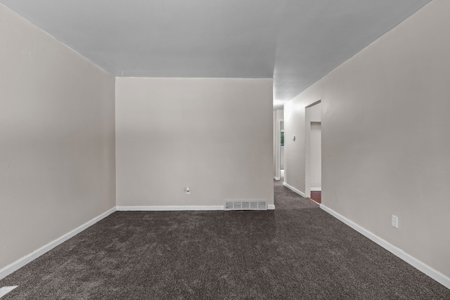 289 Nebraska Ave, Pontiac, MI 48341 - empty room featuring baseboards, dark colored carpet, and visible vents
