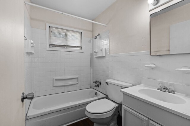 289 Nebraska Ave, Pontiac, MI 48341 - bathroom with shower / tub combination, tile walls, toilet, and vanity