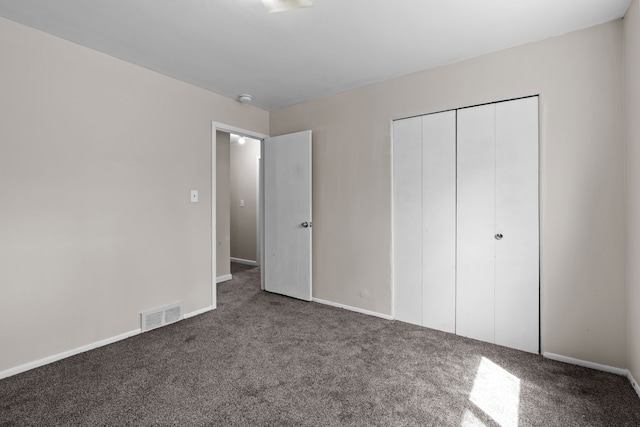 289 Nebraska Ave, Pontiac, MI 48341 - unfurnished bedroom with a closet, baseboards, carpet flooring, and visible vents