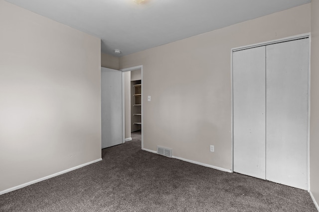 289 Nebraska Ave, Pontiac, MI 48341 - unfurnished bedroom with a closet, baseboards, carpet flooring, and visible vents