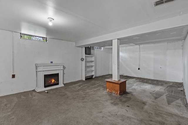 289 Nebraska Ave, Pontiac, MI 48341 - basement with visible vents, carpet, and a glass covered fireplace